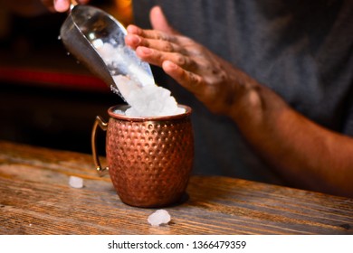 bartender adding ice slush
