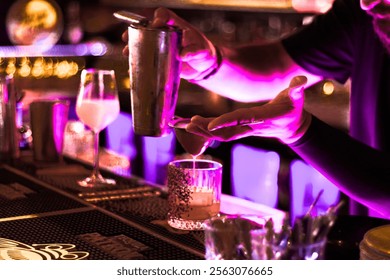 Bartender crafting a cocktail at the bar, perfect for vibrant bar scenes and drink menus