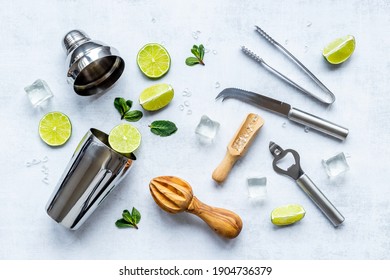 Bartender Equipment And Cocktail Ingredietns - Shaker, Lime And Ice. Overhead View