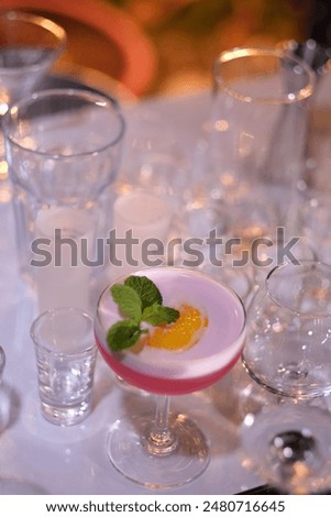 Bartender makes alcoholic drinks is a beautiful.