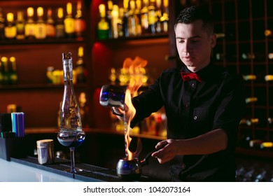 Bartender makes hot cocktail. - Powered by Shutterstock