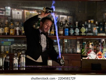 Bartender Making A Cocktail With Fire In An Old Pub