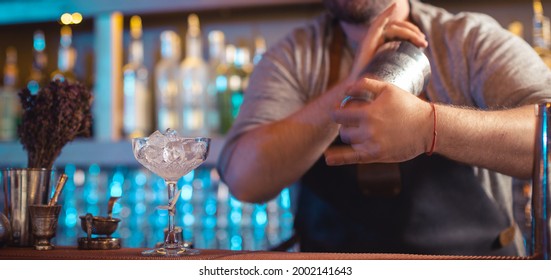 Bartender Making A Cocktail Using Cocktail Shaker