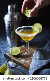 Bartender Making Margarita Cocktail.Close Up Of Classic Lime Margarita Coctail With Salt Served In Martini Glass.