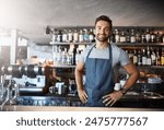 Bartender, man and happy in portrait at counter with service for drinks, cocktails and liquor in restaurant. Person, barman and small business owner with glasses, ready and waiter for alcohol at pub