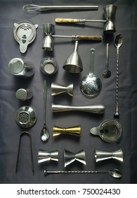 Bartender And Mixology Tools Resting On A Dark Grey Table Top