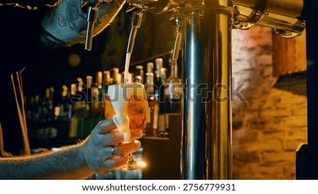 Bartender pouring draft beer into glass with foam spilling in warm cinematic bar light. Concept of beverage marketing visuals, promo content, bar branding, social media campaign, and hospitality ads.
