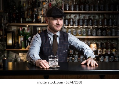 Bartender bartender is pouring a drink - Powered by Shutterstock
