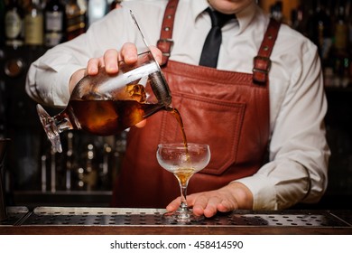 Bartender Pouring Fresh Cocktail In Fancy Glass