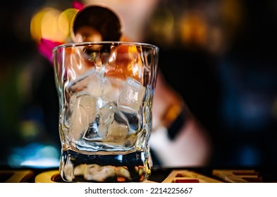 Bartender Pouring Gin In Bar