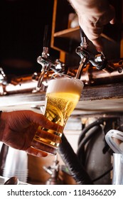 Bartender Pours A Light Beer Close Up