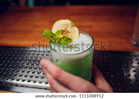 Bartender prepares cocktail