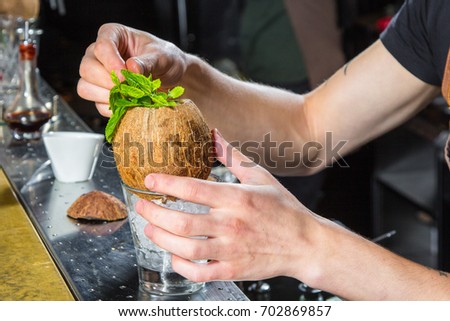 Bartender prepares a cocktail