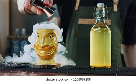 bartender prepares tiki cocktail - Powered by Shutterstock