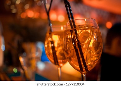 Bartender preparing alcoholic aperitif, aperol spritz cocktail 