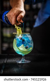 Bartender Preparing A Blue Gin Tonic With Curacao