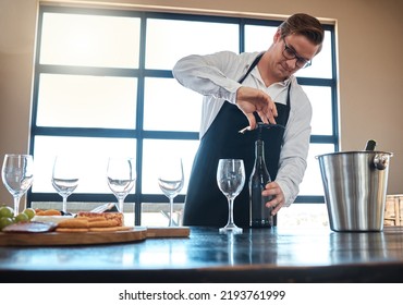 Bartender With Red Wine Tasting At Luxury Restaurant Or Vineyard And Vintage Alcohol Bottle And Glasses For Fine Dining, Culinary Or Hospitality Industry. Sommelier Service With Quality Alcohol