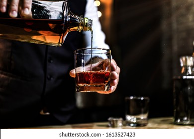 Bartender Serve Whiskey, on wood bar, - Powered by Shutterstock