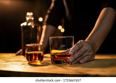 Bartender Serve Whiskey, on wood bar, - Powered by Shutterstock