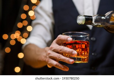 Bartender Serve Whiskey, on wood bar,  - Powered by Shutterstock