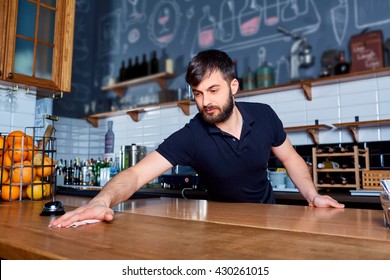 Bartender Wiping Down Bar Counter