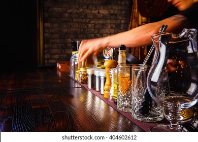 Bartender Works With Tools On Bar At The Night Club