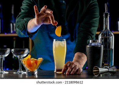 Bartender's Hands Shaking Cocktails On Bar Counter In A Restaurant, Pub. Professional Mixologist Mixing Drinks. Alcoholic Cooler Beverage At Nightclub. Selected Focus, Shallow Depth Of Field.