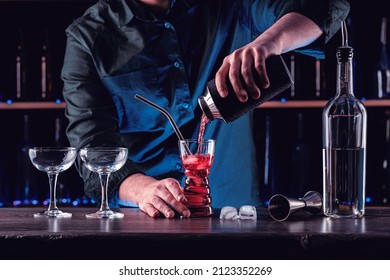 Bartender's Hands Shaking Cocktails On Bar Counter In A Restaurant, Pub. Professional Mixologist Mixing Drinks. Alcoholic Cooler Beverage At Nightclub. Selected Focus, Shallow Depth Of Field.