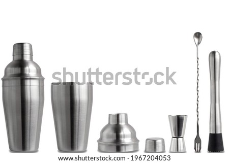Bartender's kit on a white background in isolation. Metal shaker in disassembled form.