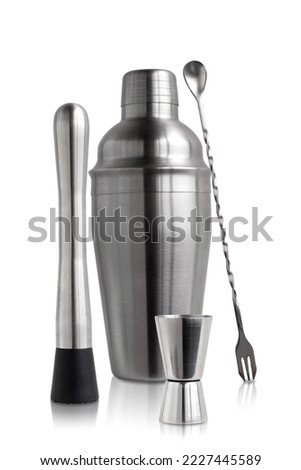 A bartender's set on a white background in isolation. Metal cocktail shaker.