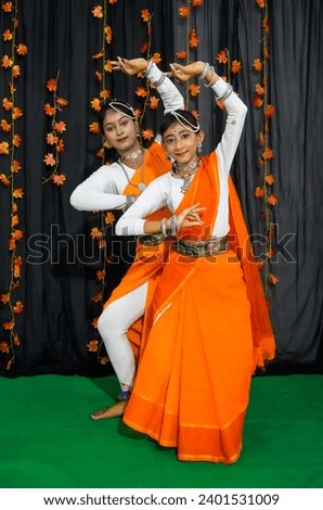 Baruipur, West Bengal, India: Two girls are standing in a dancing pose.