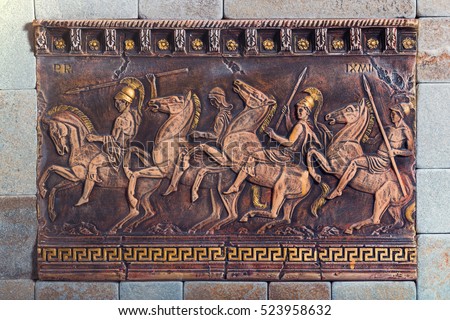 Bas relief of the ancient soldiers on the battle horses