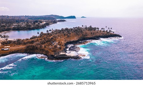 Basalt cliffs roar at Boca do Inferno, Água Izé, São Tomé — a dramatic viewpoint where waves crash through narrow volcanic arches.