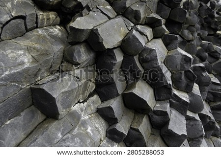 Basalt column wall inside Halsanefshellir cave on Reynisfjara beach, Iceland