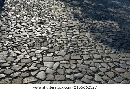 basalt hexagonal natural column created by the gradual solidification of lava, is used in the city as a safety dividing bollard on the corner of the lawn, sidewalk. pedestrian protection