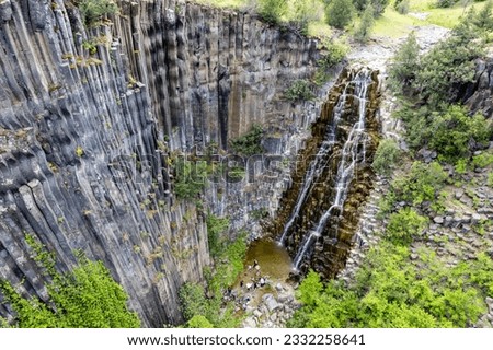 Basalt Rocks in Boyabat District. Sinop, Turkey. Volcanic rock outcrops in the form of columnar basalt located in Sinop. Basalt Rocks Nature Monument with waterfall.