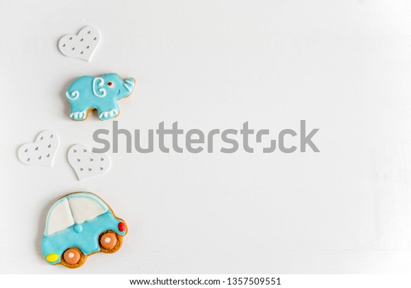 Base, frame for baby banner, childish greeting\
card with gingerbread. Cars and elephants on a white wooden\
background. Party Banner\
Background
