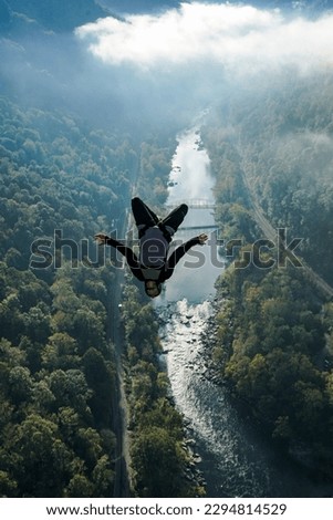 BASE jumper leaps and does a backflip from New River Gorge Bridge in West Virginia