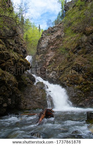 At the base of the Thunderbird Falls.