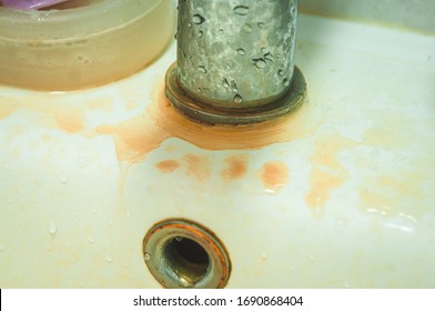 The Base Of The Washstand Is In Brown Spots From Hard Water With An Excess Of Iron.