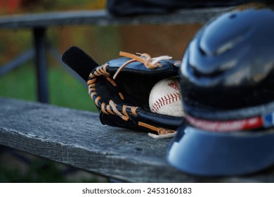 Baseball accessories,  baseballs, home base and baseball helmet on small town baseball field - Powered by Shutterstock