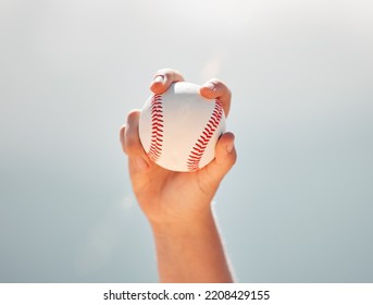 Baseball, Athlete Hands And Ball Sports While Showing Grip Of Pitcher Against A Clear Blue Sky. Exercise, Game And Softball With A Professional Player Ready To Throw Or Pitch During A Match Outside