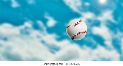 Baseball Ball In The Air. Sport Games. Blurred Sky Background