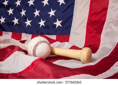 A baseball and bat with an American flag background. - Powered by Shutterstock