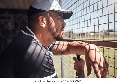 Baseball, bat and game with man in dugout, watching team sports outdoor for competition or fitness. Club, exercise and serious with person at stadium or venue for challenge, match or performance - Powered by Shutterstock