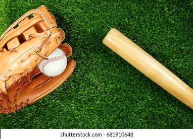  Baseball Bat With Glove And Ball On Field, Top View.