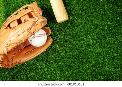  Baseball Bat With Glove And Ball On Field, Top View.