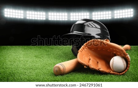 Baseball bat, glove, helmet and ball on grass at stadium. Banner design with space for text