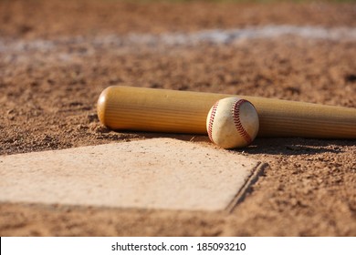 Baseball And Bat At Home Plate Close Up