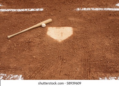 Baseball & Bat Near Home Plate And The Batters Box